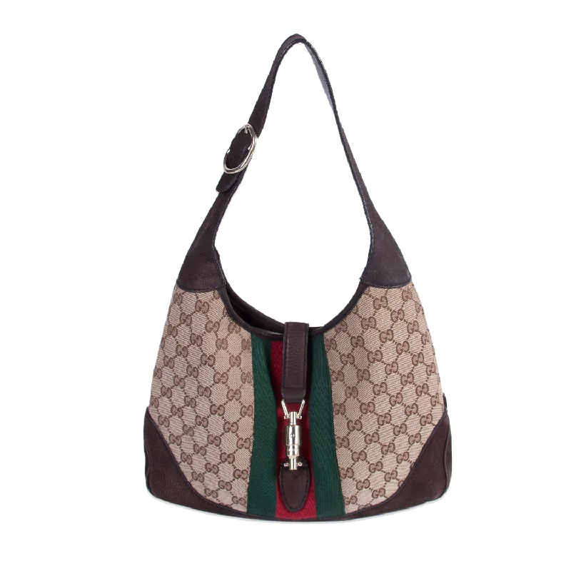 Ladies Gucci shoulder bags with a tassel decorationLadies Gucci shoulder bags with a tassel decorationGucci Jackie Web Stripe Canvas Suede Shoulder Bag