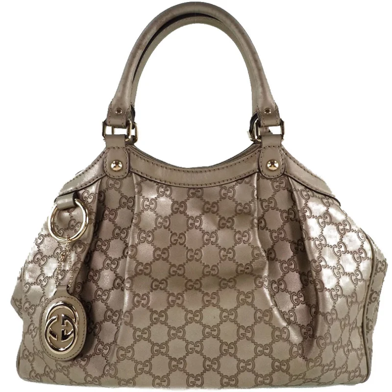 Women Gucci bags with a chain - link trim and a leather bodyWomen Gucci bags with a chain - link trim and a leather bodyGucci Suki Interlocking G 211944 Striped Leather Gold Women's Handbag