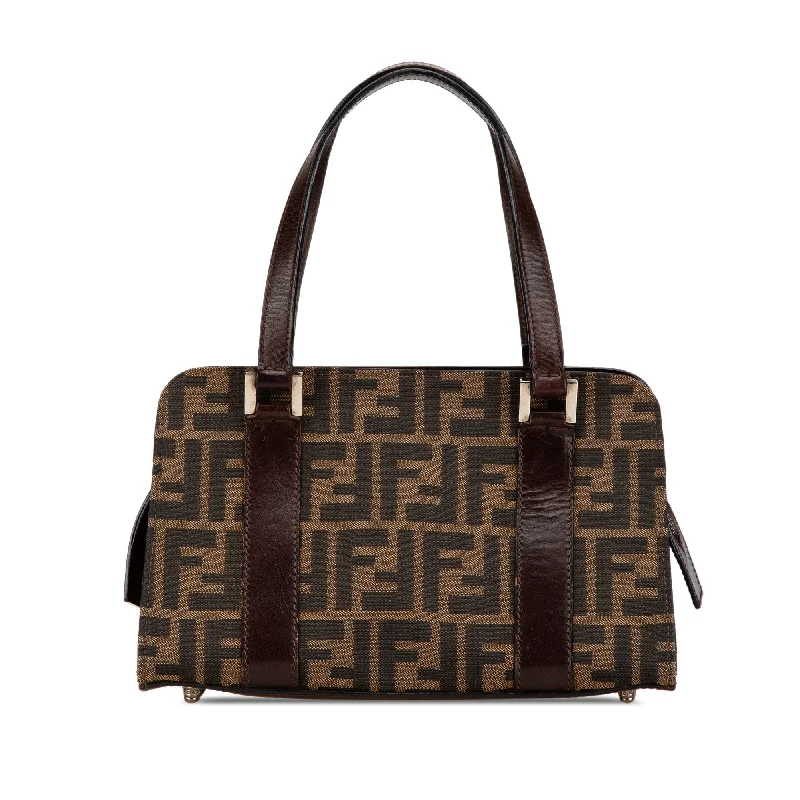 Fendi tote bags with a snap - button closure and a decorative charm for a fashionable and personalized lookFendi tote bags with a snap - button closure and a decorative charm for a fashionable and personalized lookBrown Fendi Zucca Canvas Handbag