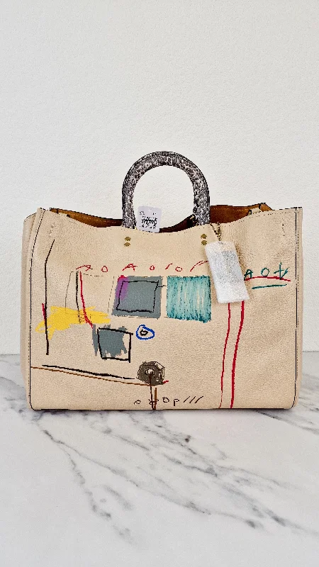 Coach bags with a front - zip pocket for small items like keys and cardsCoach bags with a front - zip pocket for small items like keys and cardsCoach Rogue 39 Jean-Michel Basquiat Bag in Ivory Pebble Leather with Snakeskin - Handbag Shoulder Bag - Coach 6877